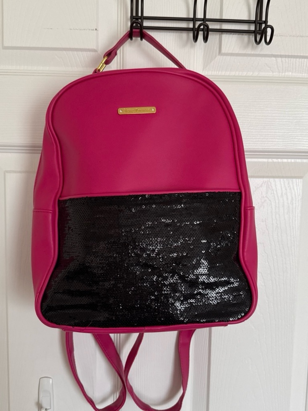 Women's Juicy Couture Hot Pink and Black Sequin backpack with gold detailing.
